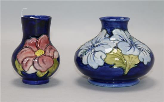A Moorcroft Hibiscus pattern squat baluster vase, pale blue flowers on a cobalt ground and a small anemone vase, H 10cm